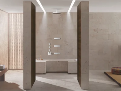 An open concept bathroom with a seated shower and spa-style amenities.